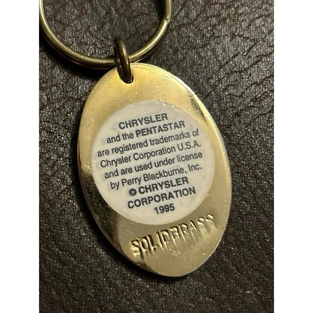 Vintage Chrysler keychain from 1995 gold color